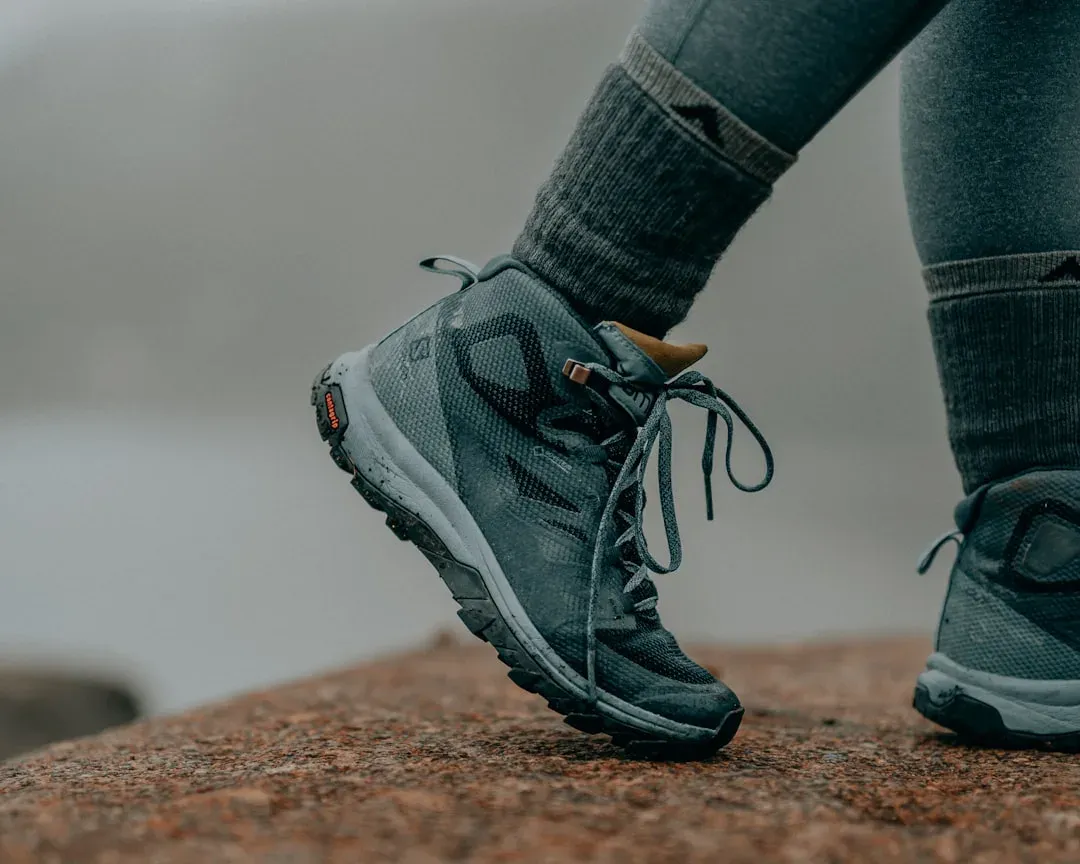 hiking boots and trekking gear laid out